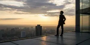 An investor planning to recover structured product losses while looking over a city.